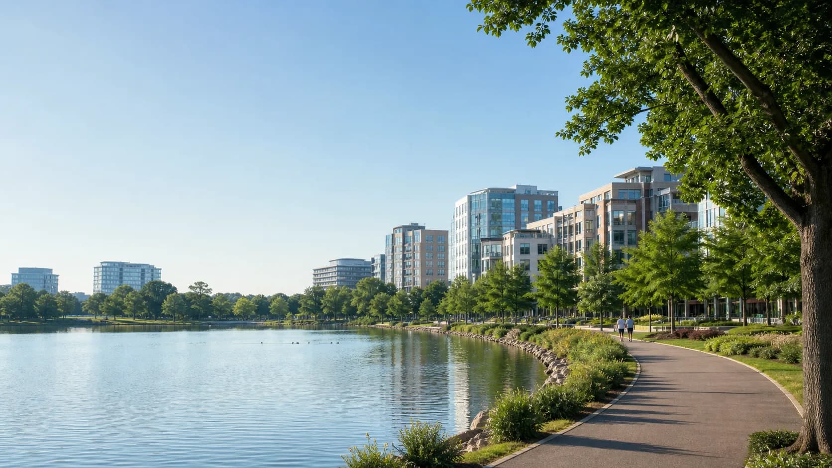 Lakeside trail and modern town-center buildings representing Reston, Virginia