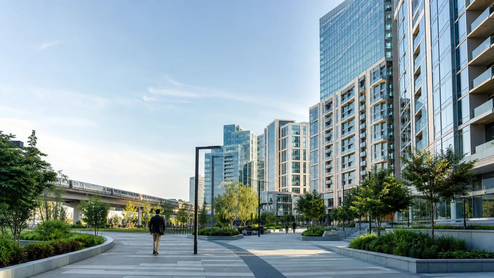 Modern high-rises, landscaped plaza, and Silver Line train representing Tysons, Virginia